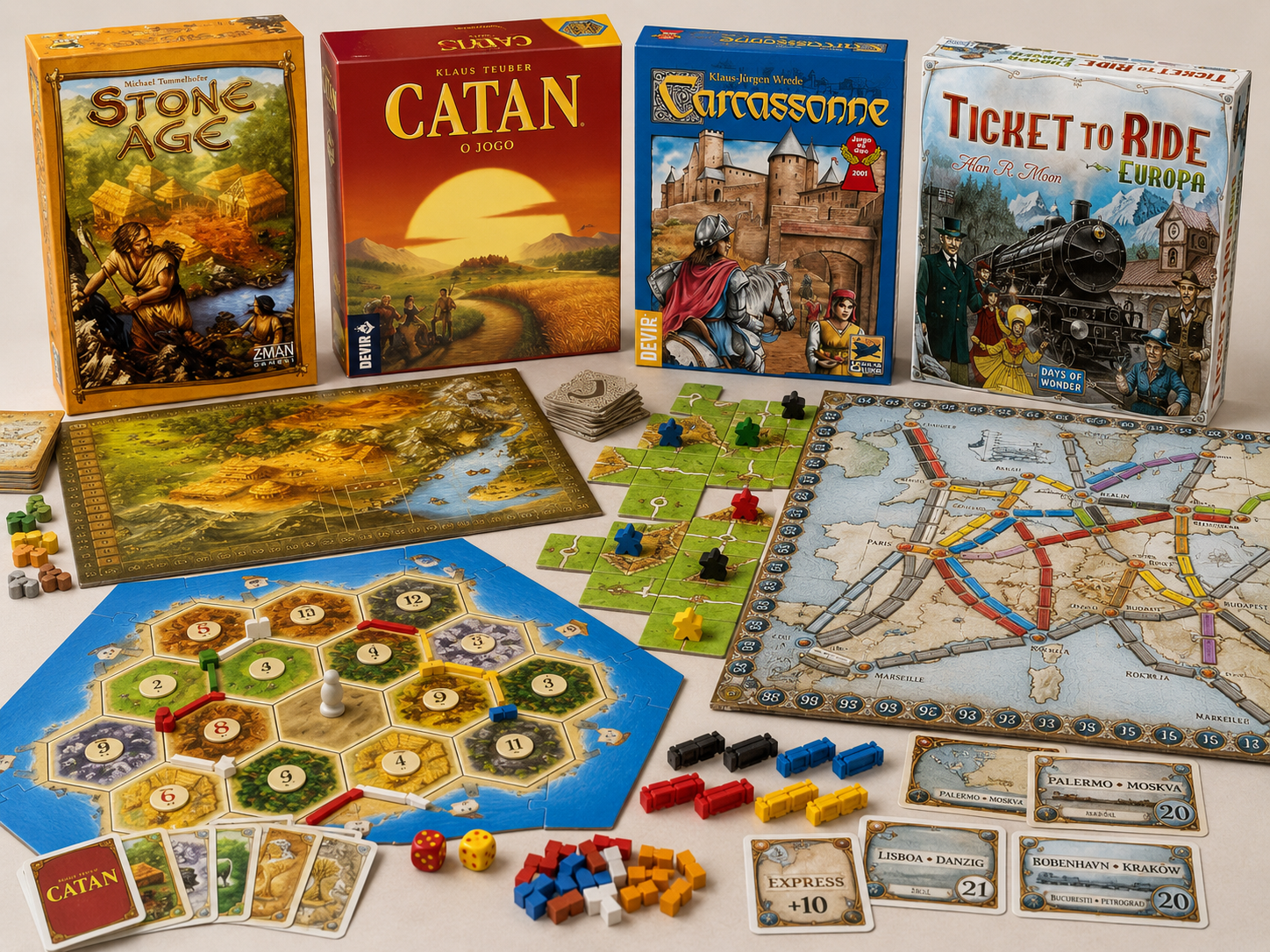 Jogos de estratégia Catan, Ticket to Ride, Carcassonne e Stone Age montados na mesa